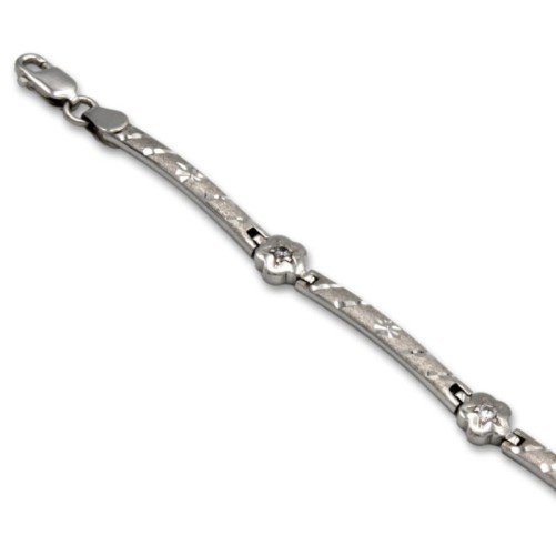 Pulsera de oro blanco con circonitas y flores